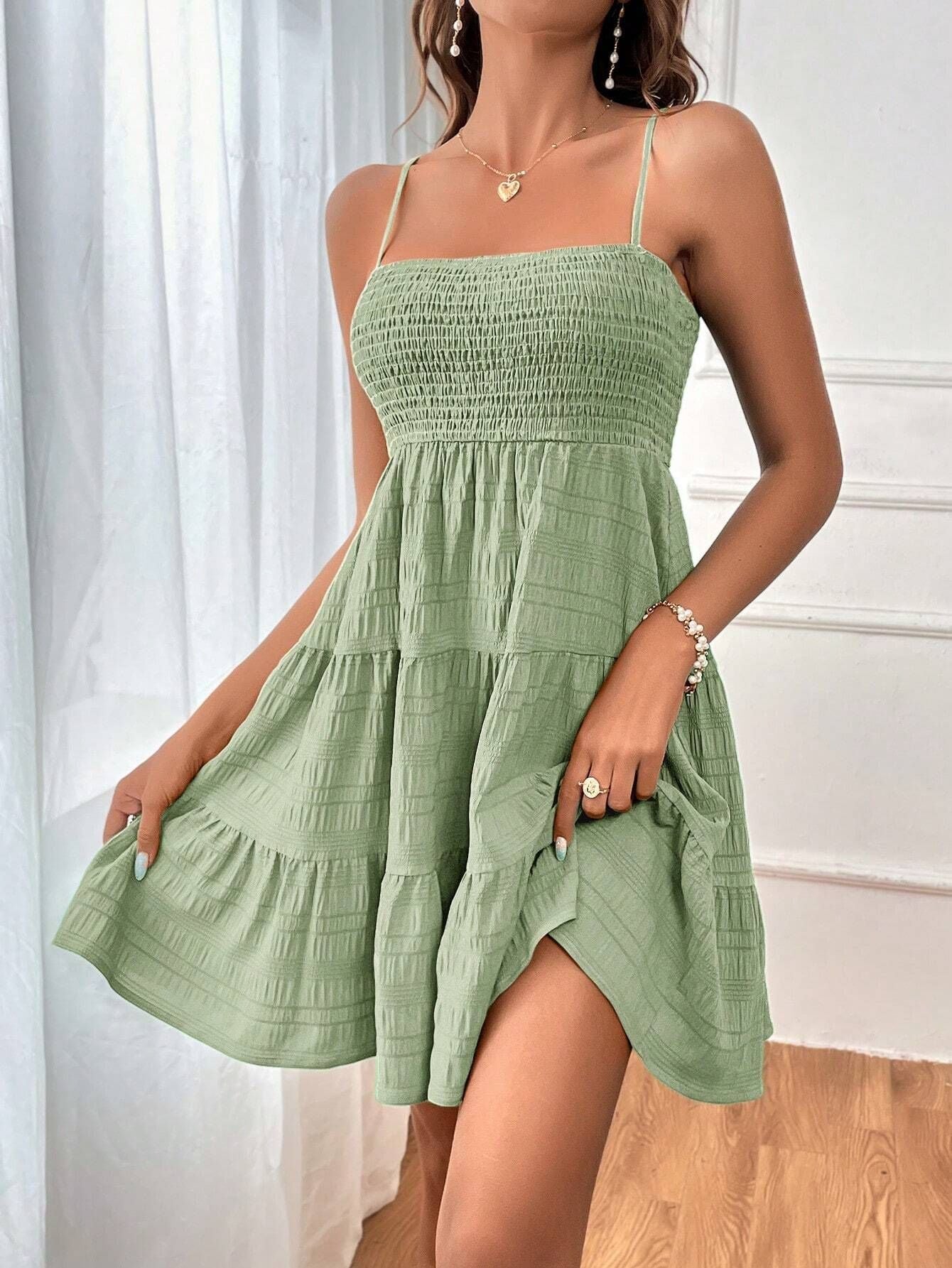 Women's casual dress with narrow straps and ruffle details, size
