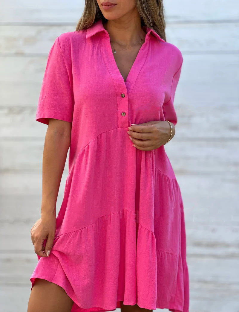 Women's loose-fitting shirt dress with button details and flowing hem, size