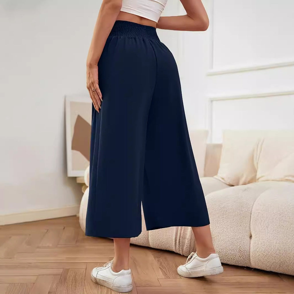Women's wide-leg, high-waisted palazzo pants with elasticated waistband and flowing material, size S