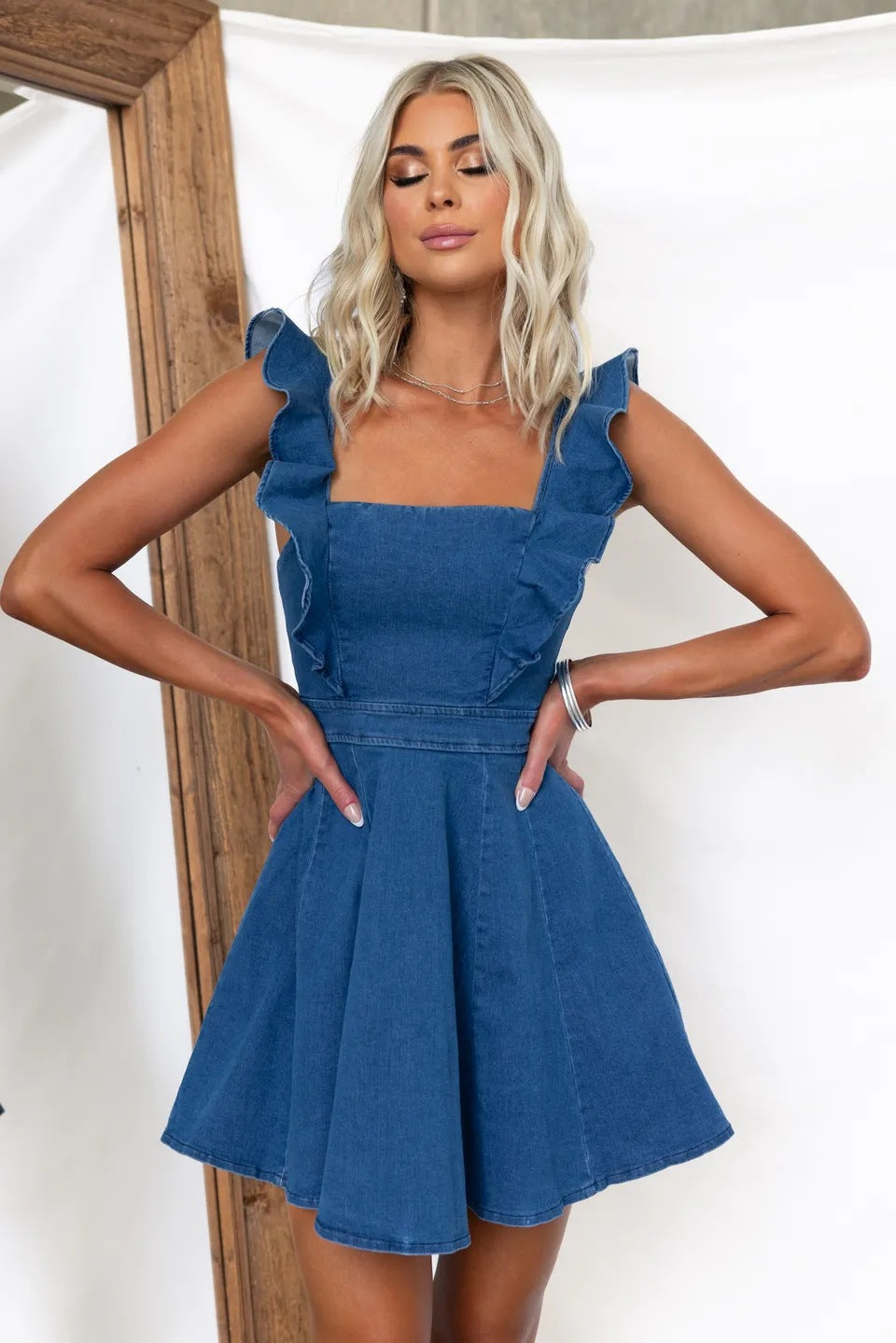 Women's denim dress with ruffle details and feminine silhouette, size S