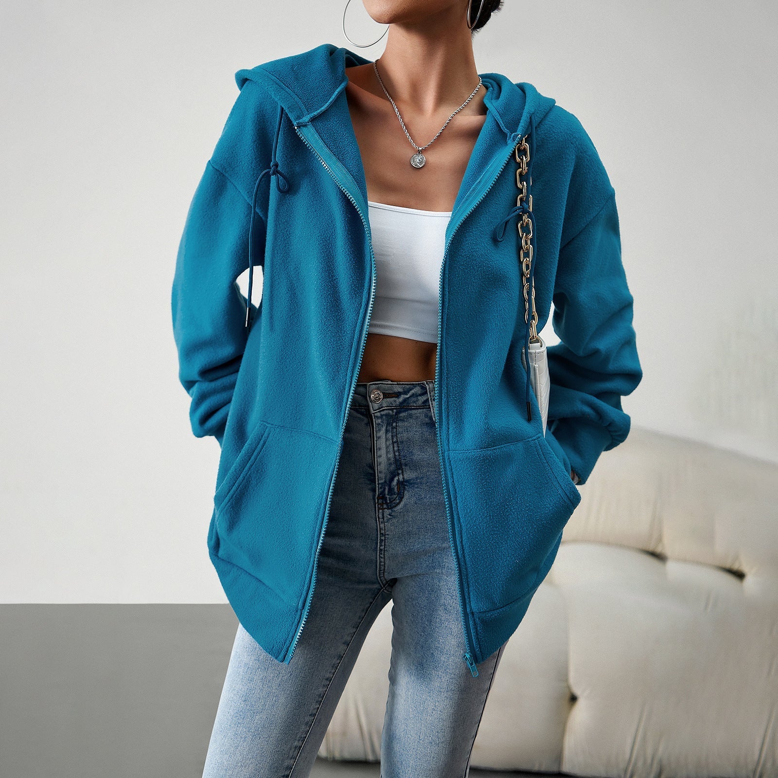 Women's fleece jacket with practical pockets and adjustable hood, size S