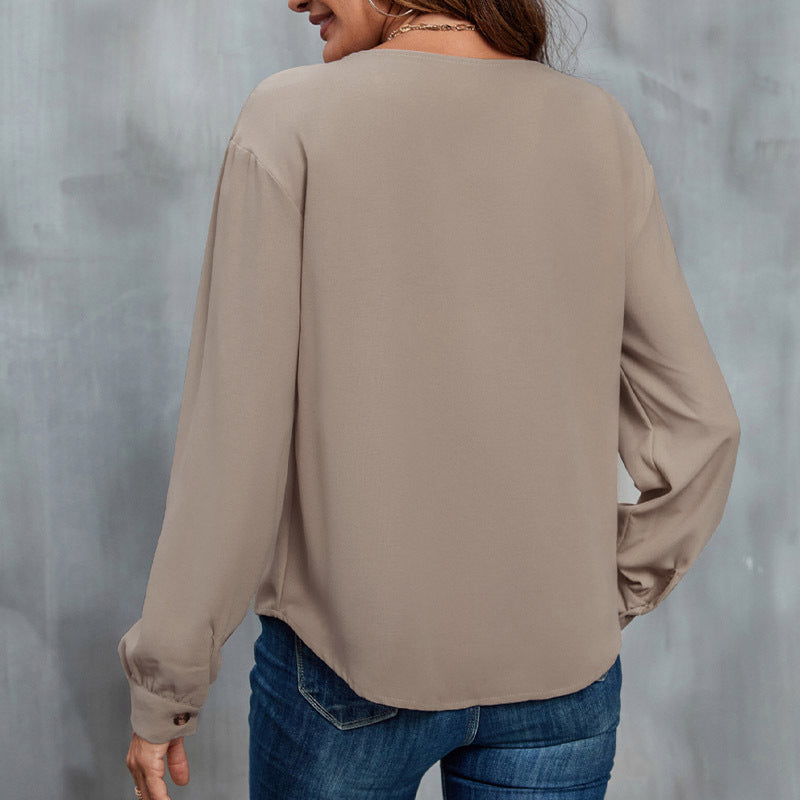 Women's blouse with asymmetrical collar and button details, size