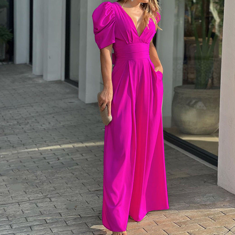 Women's elegant jumpsuit with voluminous puff sleeves and deep V-neck, size [size]
