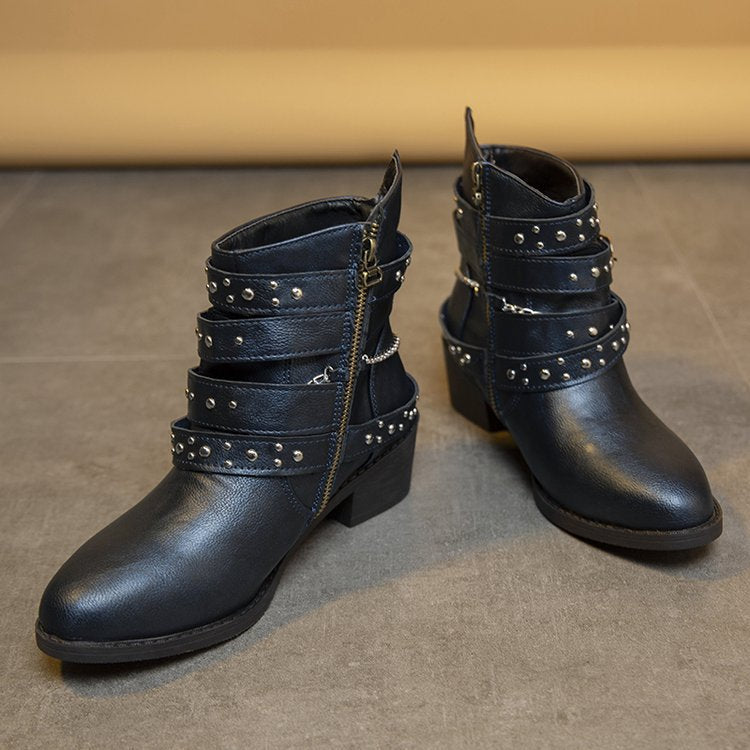 Women's ankle boots with a fashionable strap design and decorative accents, size S