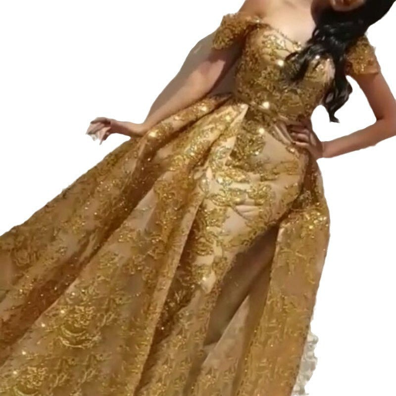 Women's glamorous evening dress with elaborate gold sequin embellishment and elegant puff sleeves, size S