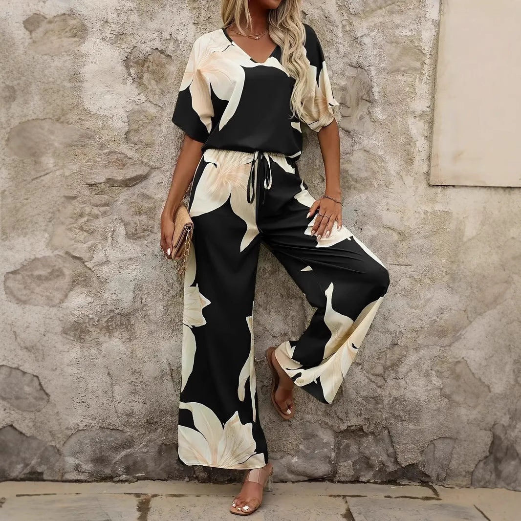 Women's relaxed jumpsuit with floral design and elasticated waistband, size