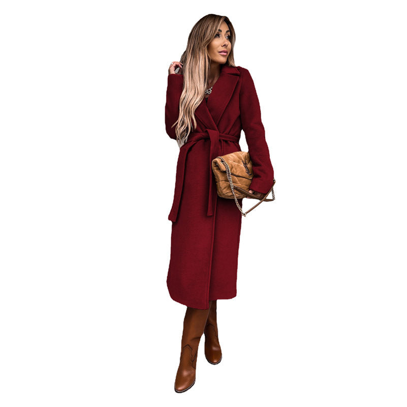 Women's elegant wool coat with tailored cut and belt, size S