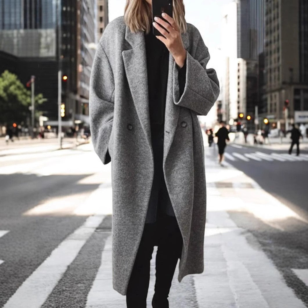 Women's oversized wool coat with an elegant cut and subtle snap buttons, size S