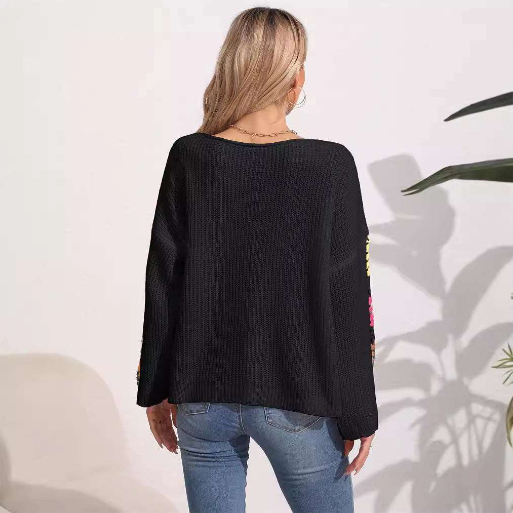 Women's elegant sweater with colorful crochet appliqués on the sleeves, size [size missing]