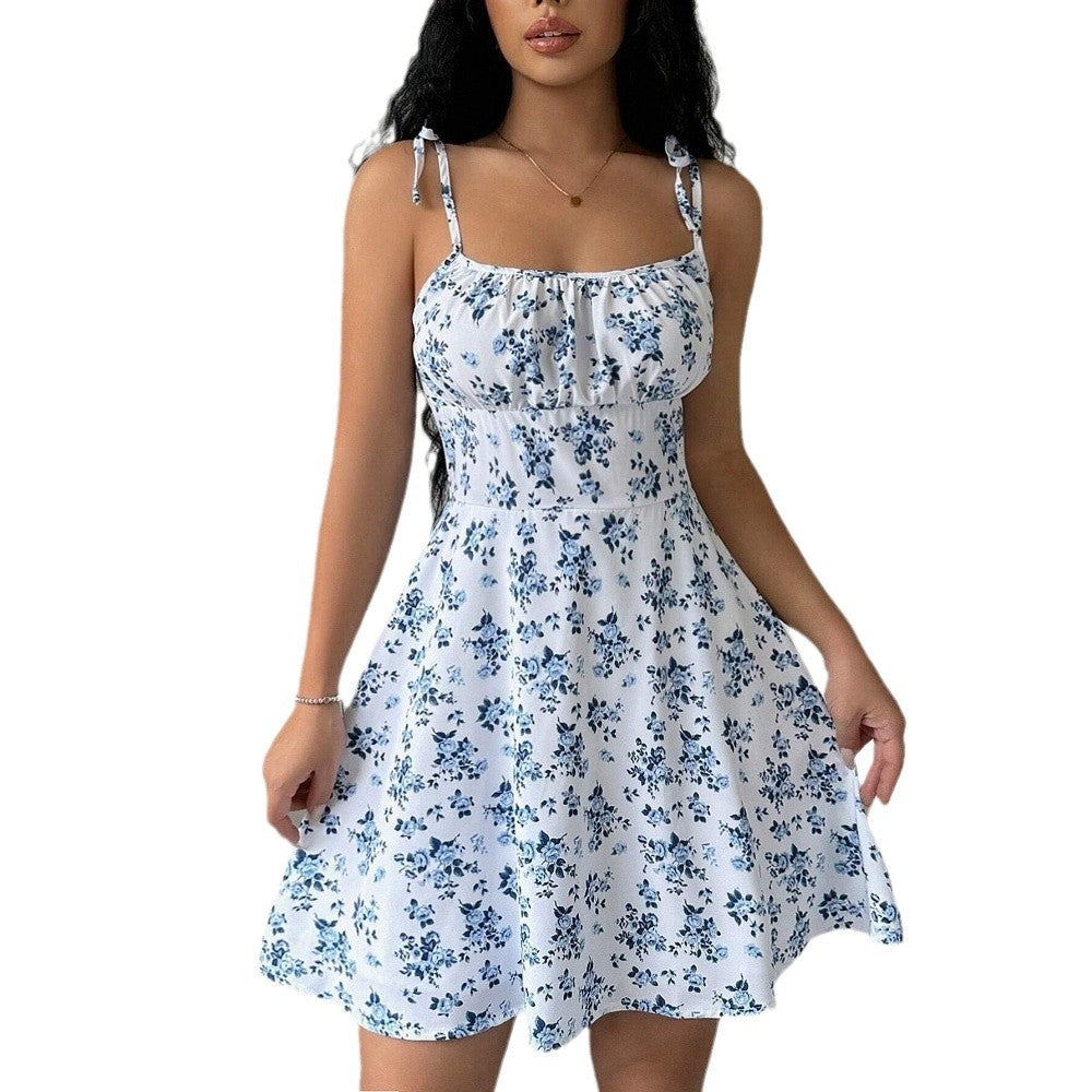 Women's summer dress with adjustable spaghetti straps and floral accents, size [size missing]