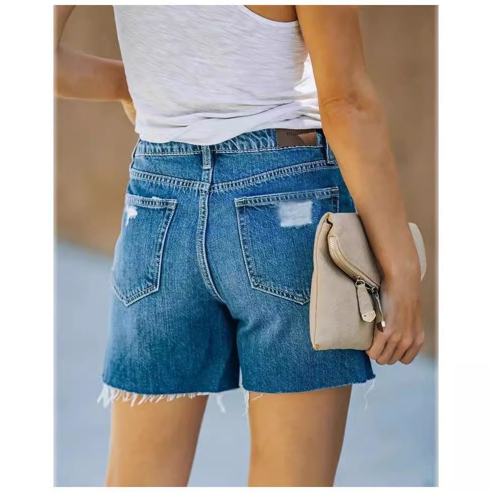 Women's denim shorts with a trendy distressed effect and a relaxed fit, size S