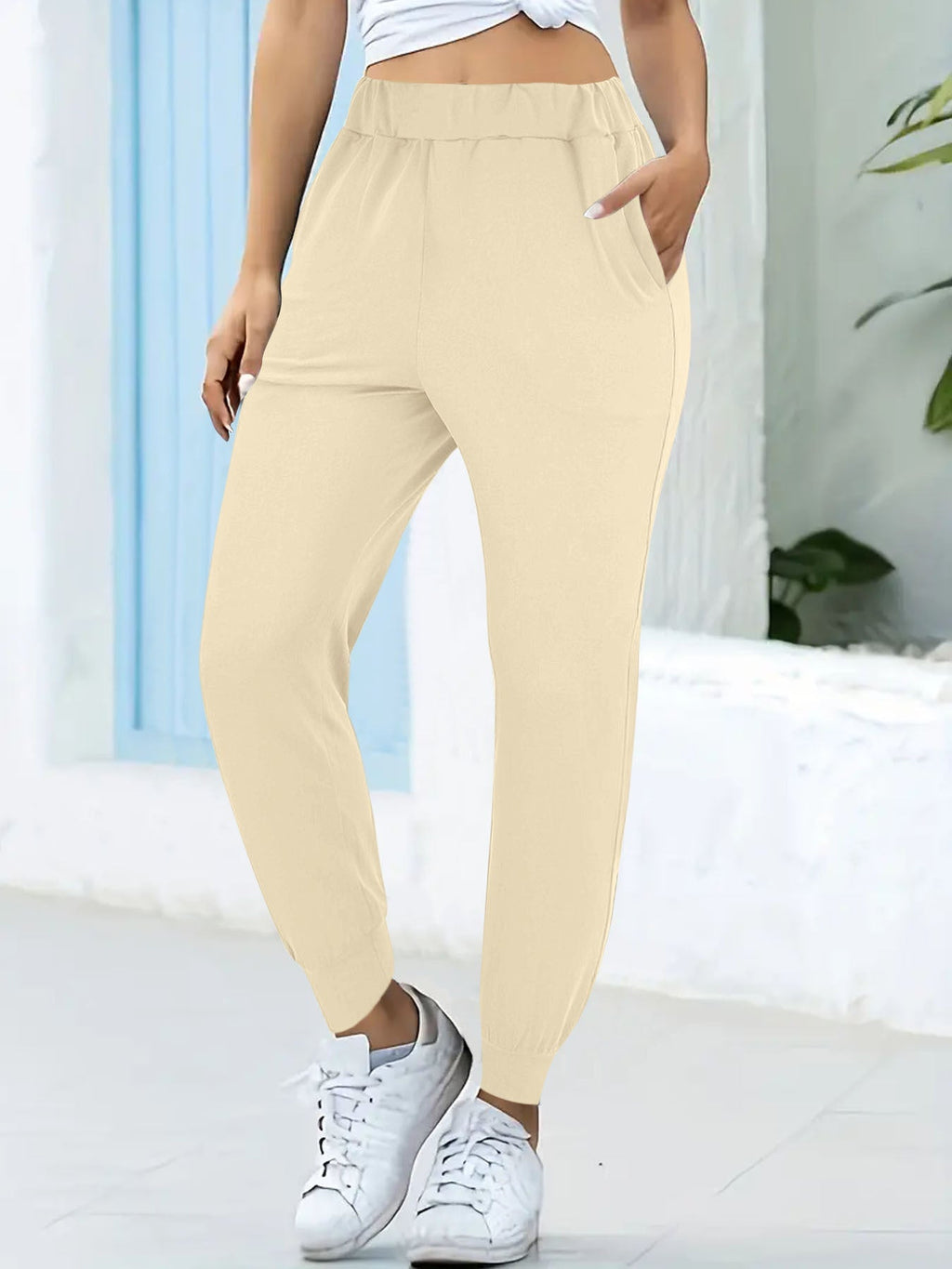 Women's comfortable jogging pants with elastic waistband and practical side pockets, size