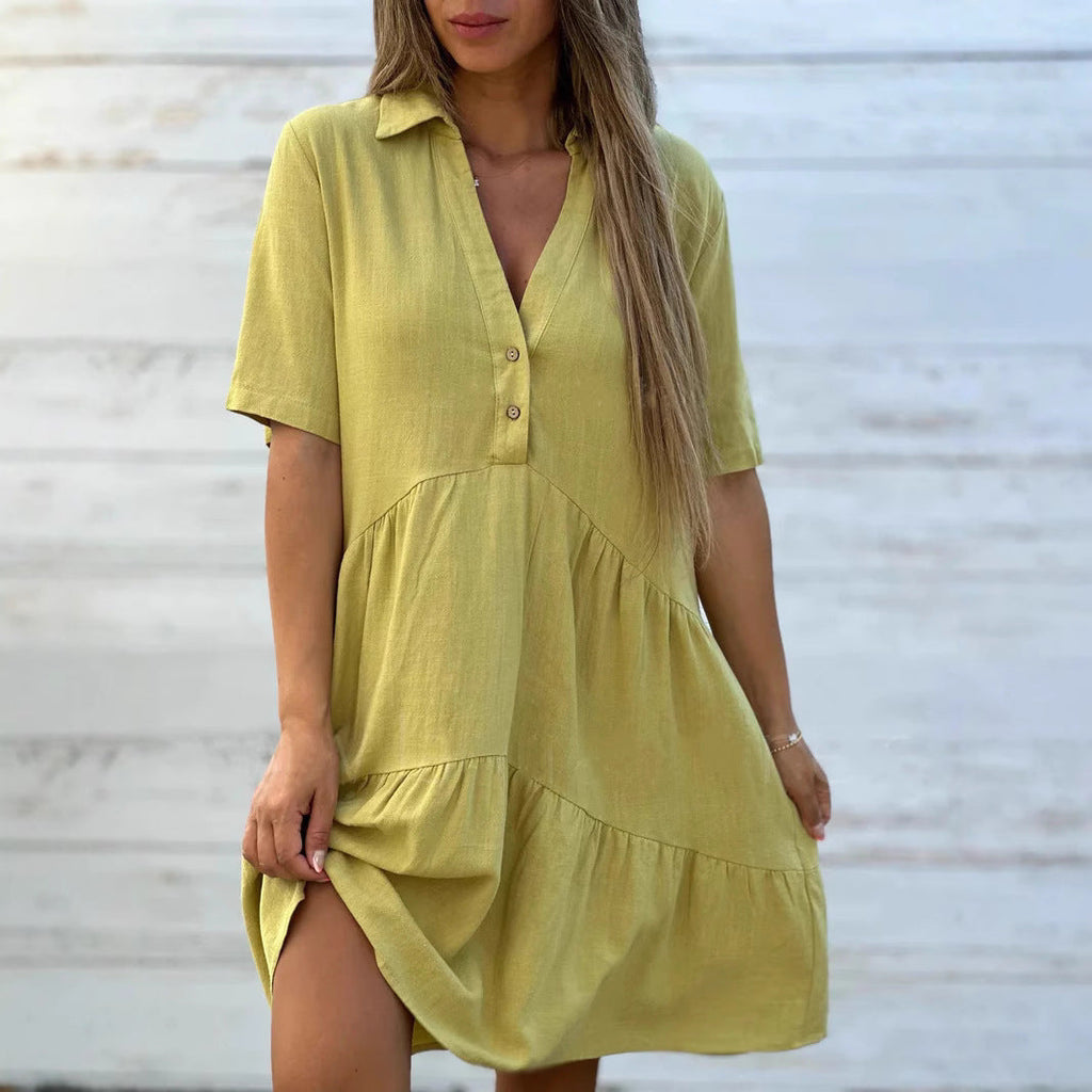 Women's loose-fitting shirt dress with button details and flowing hem, size