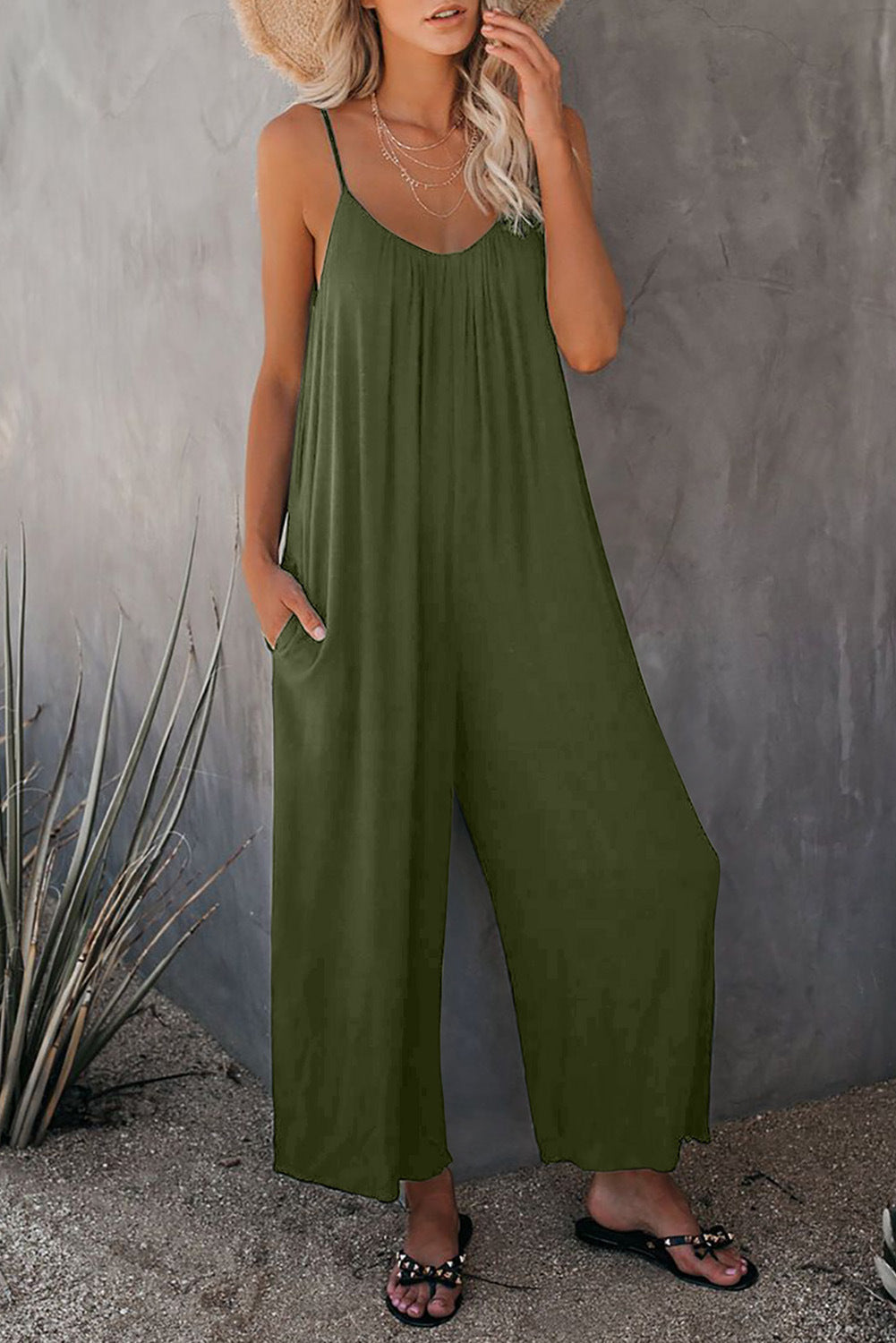 Women's casual jumpsuit with decorative straps and light, flowing fabric, size S