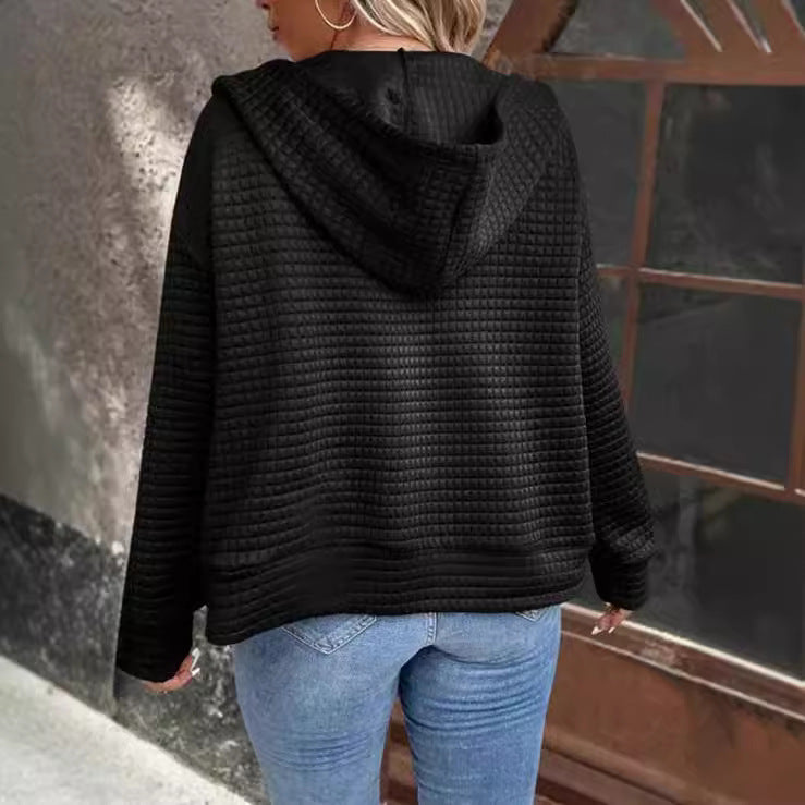 Women's loose-fitting hooded jacket with a textured waffle surface and practical pockets, size S