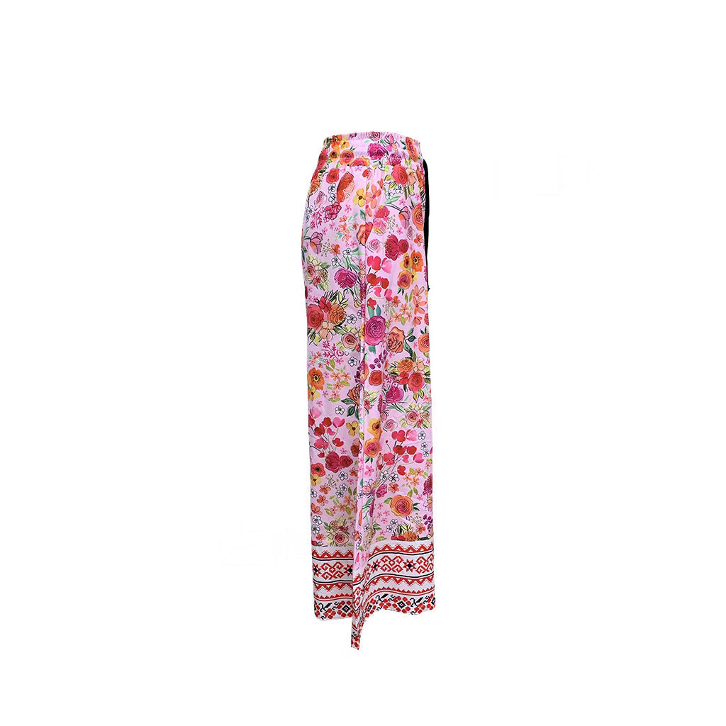 Women's wide-leg floral trousers with elasticated waistband and practical pockets, size