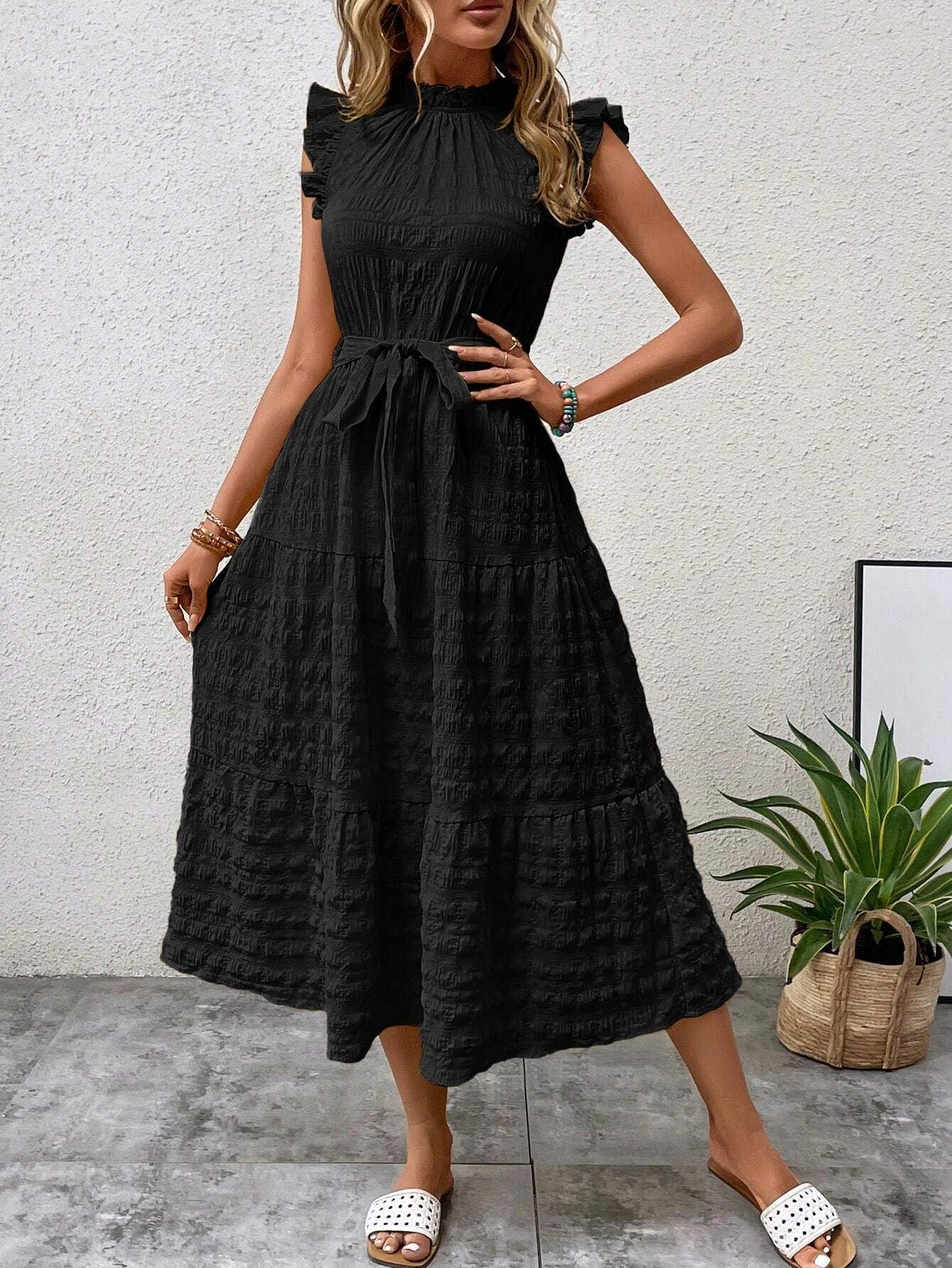 Women's wrap dress with ruffle details and a tailored hem, size