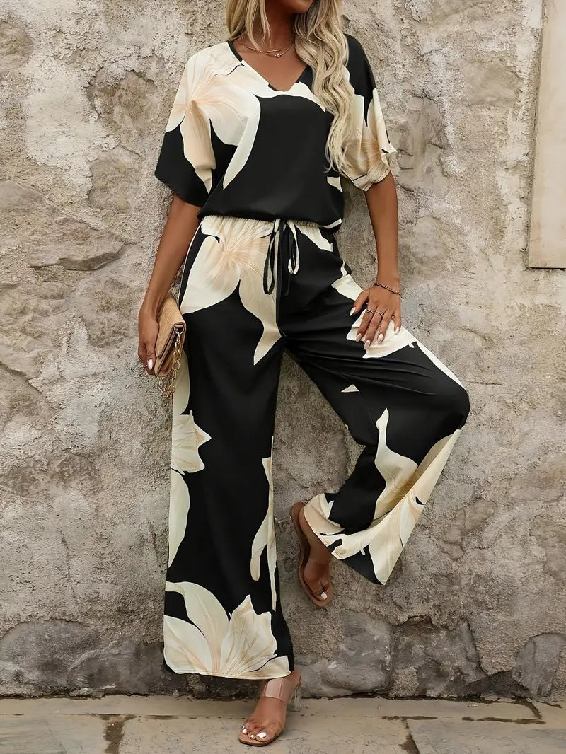 Women's relaxed jumpsuit with floral design and elasticated waistband, size