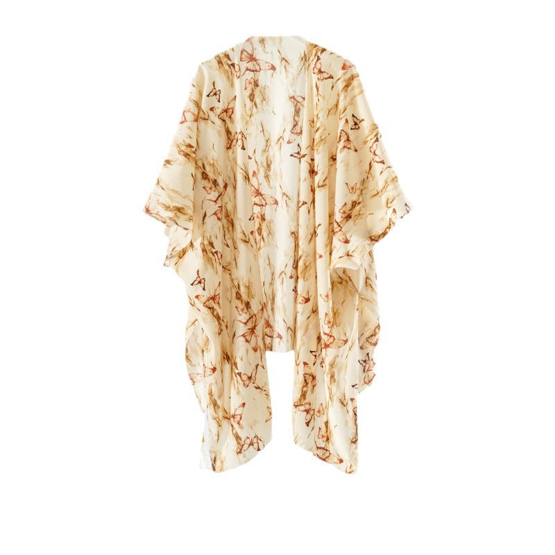 Women's elegant kimono with an artistic floral pattern and fringed edges, size GR