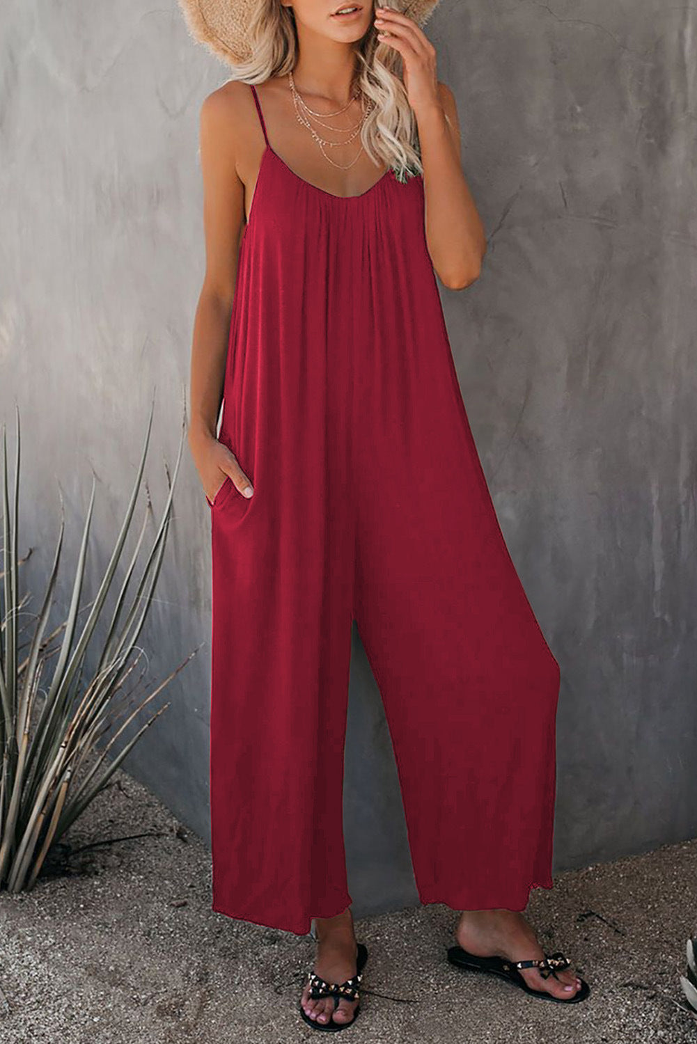 Women's casual jumpsuit with decorative straps and light, flowing fabric, size S