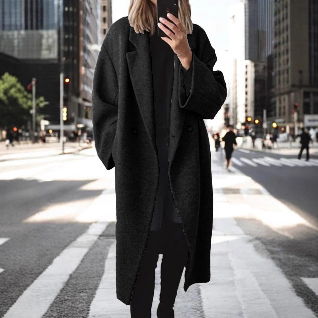 Women's oversized wool coat with an elegant cut and subtle snap buttons, size S