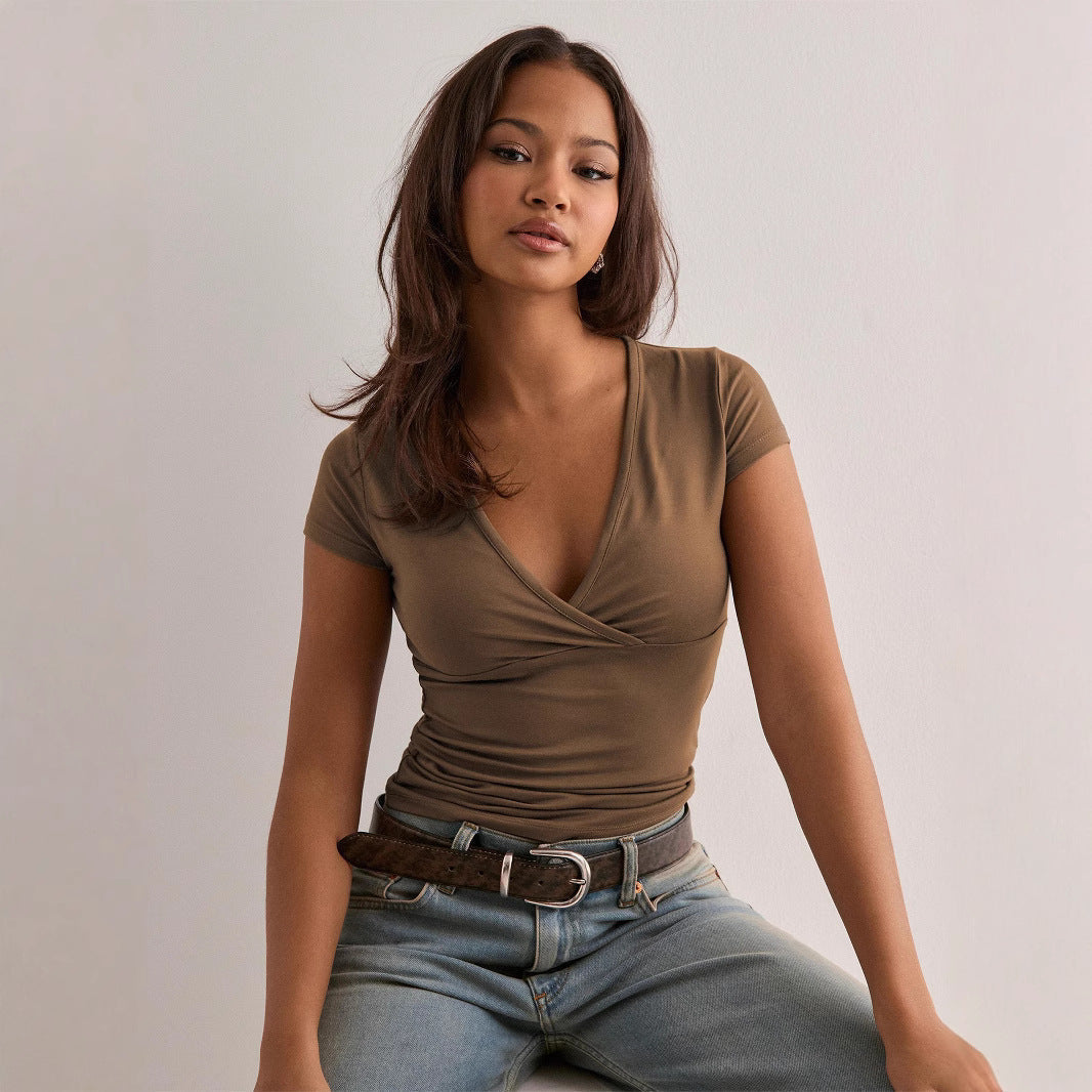 Women's wrap top with elegant ruching and figure-hugging cut, size S