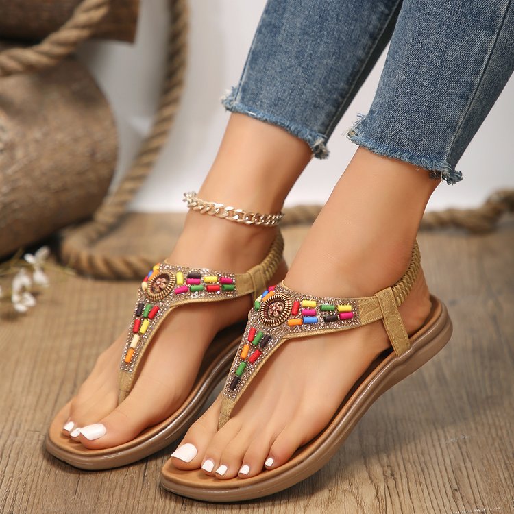 Women's thong sandals with colorful decorative detail and comfortable footbed design, size GR