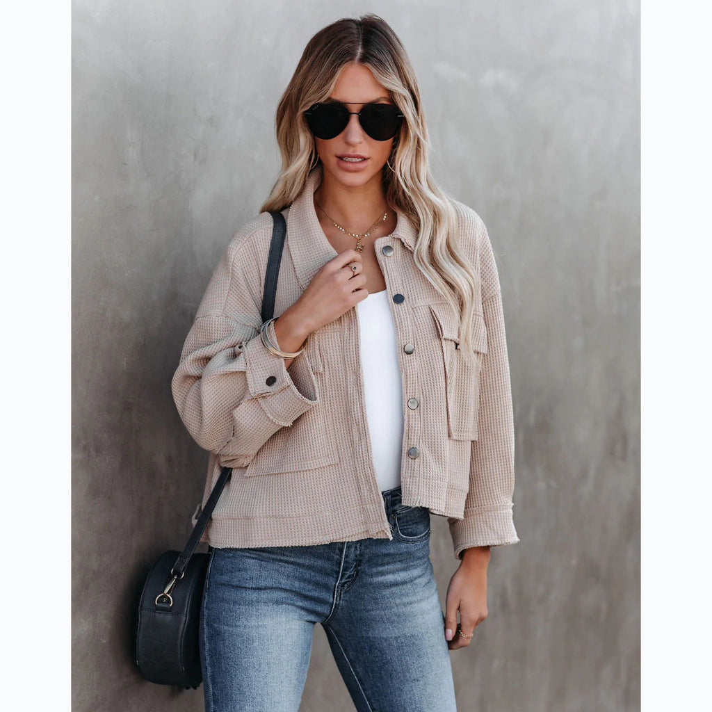 Women's short denim jacket with a casual cut and practical pocket design, size S