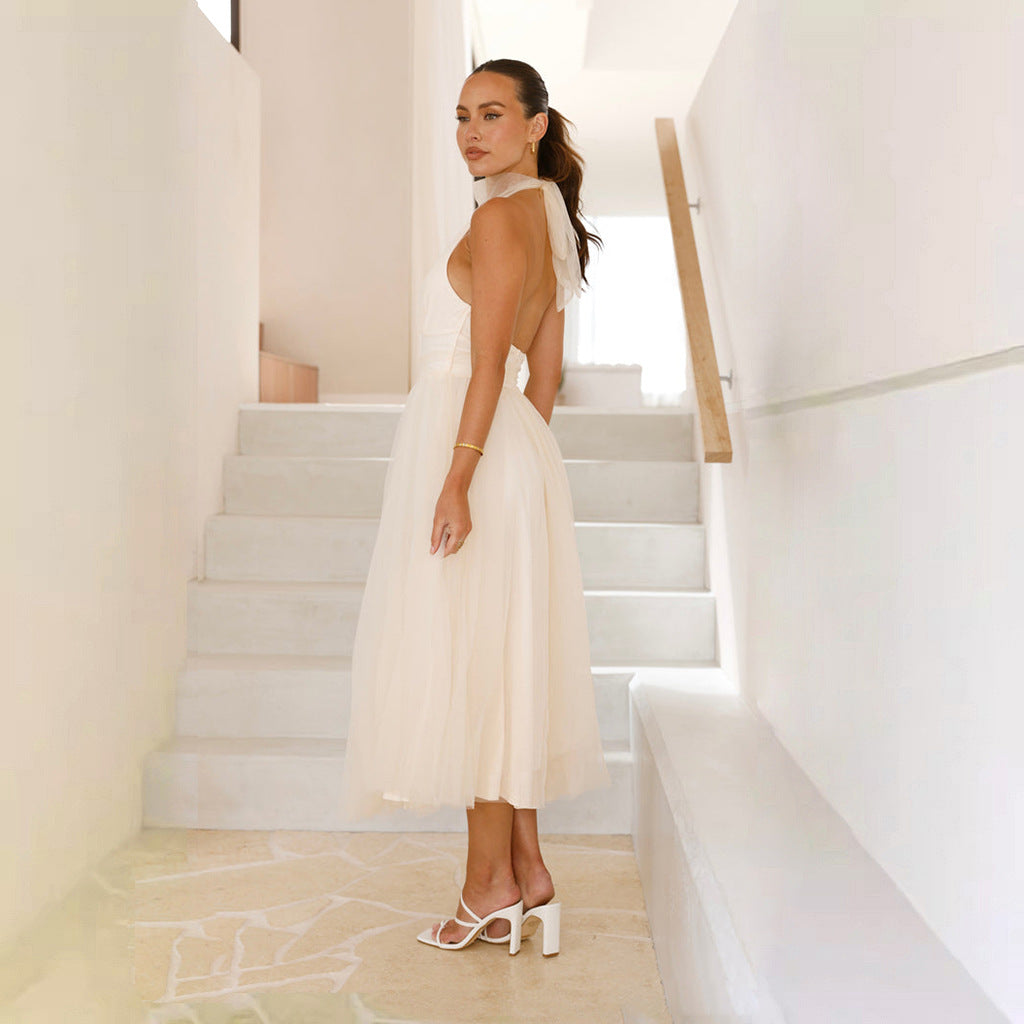 Women's elegant wedding dress with flowing tulle skirt and halter neck design, size S