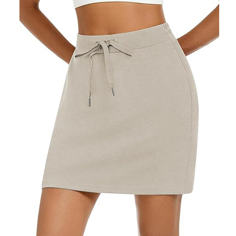 Women's sporty mini skirt with adjustable drawstring and side pockets, size