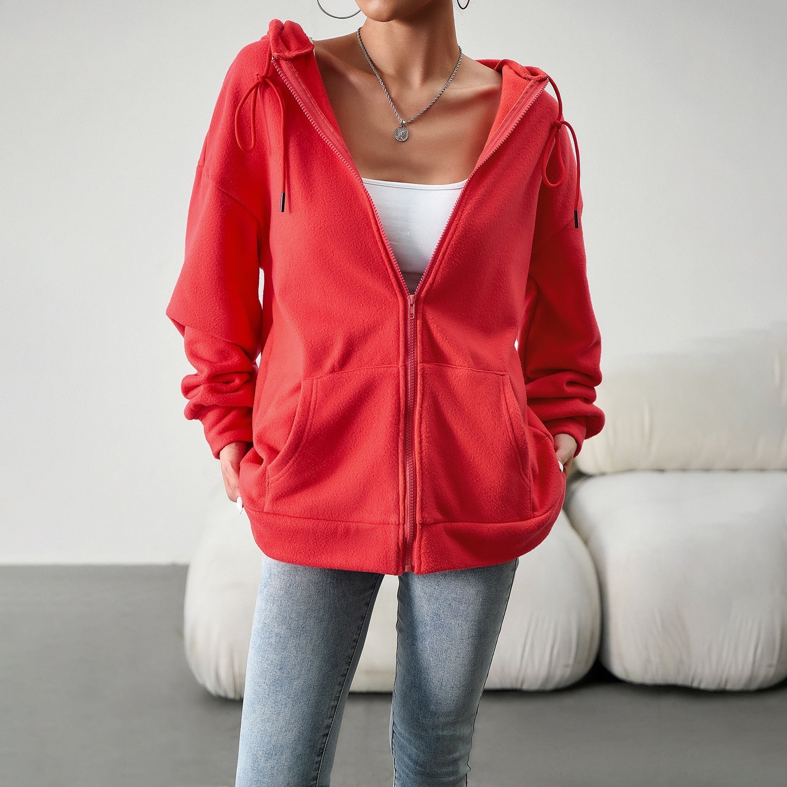 Women's fleece jacket with practical pockets and adjustable hood, size S