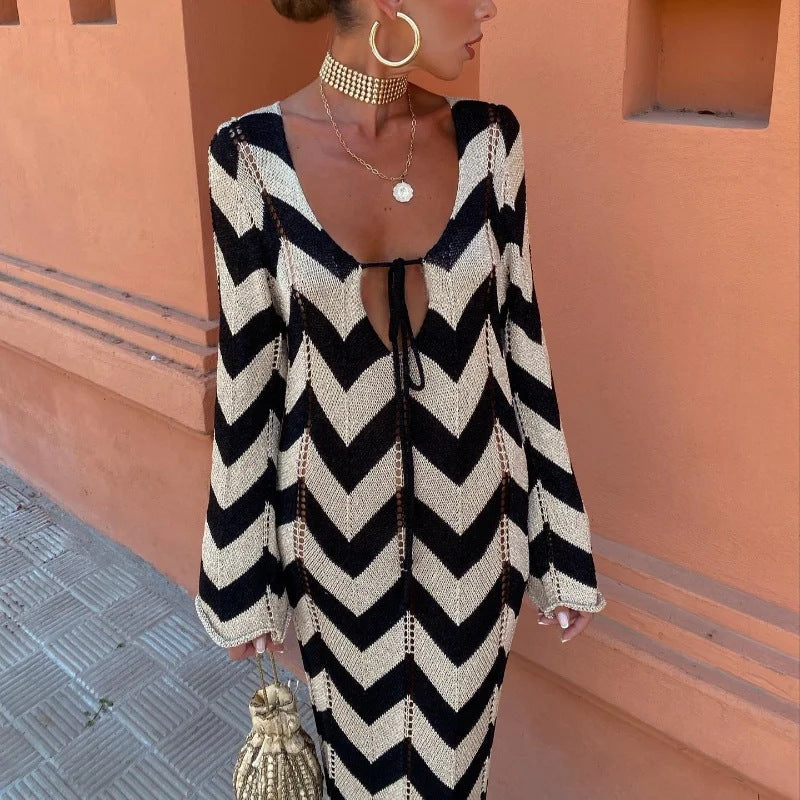 Women's knitted dress with a modern zigzag pattern and deep V-neck, size [size missing]