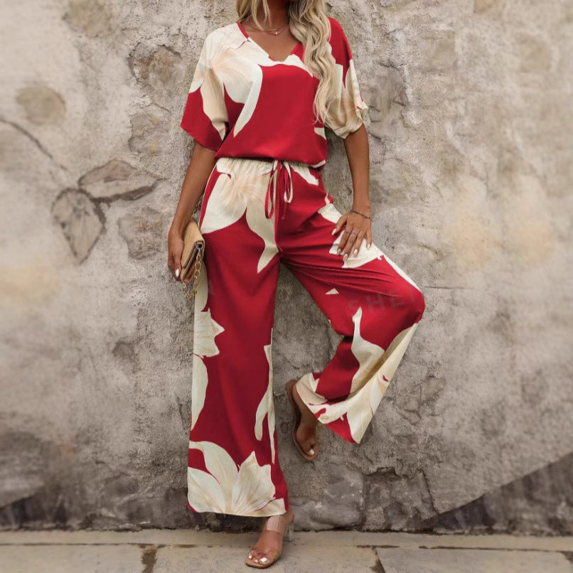 Women's relaxed jumpsuit with floral design and elasticated waistband, size