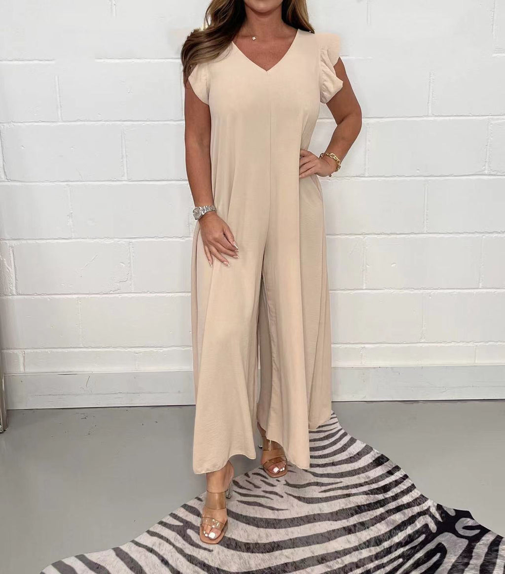Women's upscale jumpsuit with voluminous ruffled sleeves and V-neck, size S