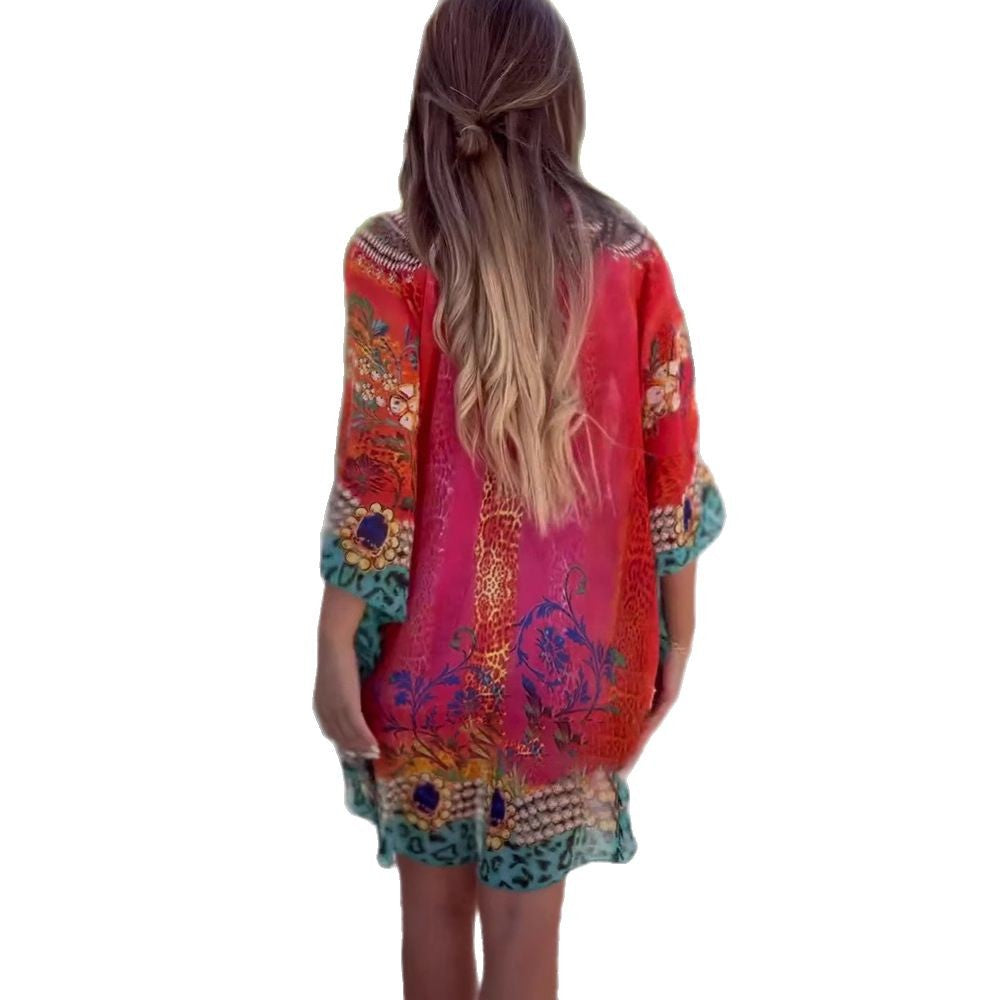 Damen Strandkleid im farbenfrohen Boho-Stil mit verspieltem Design und tiefem V-Ausschnitt GR