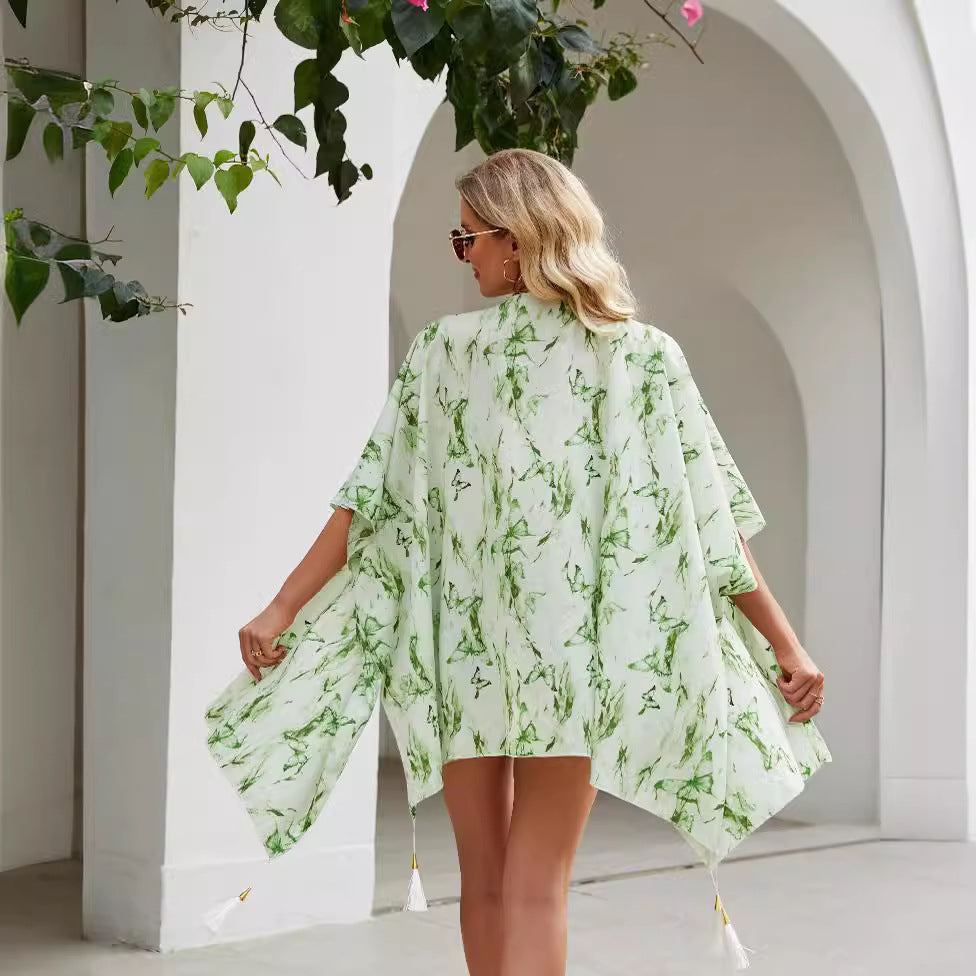 Women's elegant kimono with an artistic floral pattern and fringed edges, size GR