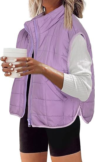 Women's quilted vest with high collar and practical side pockets, size