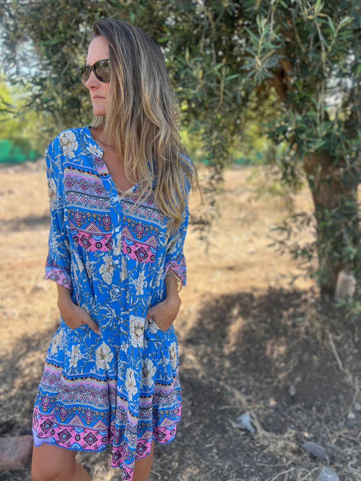 Women's boho-chic dress with floral patterns and button placket, size [size missing]