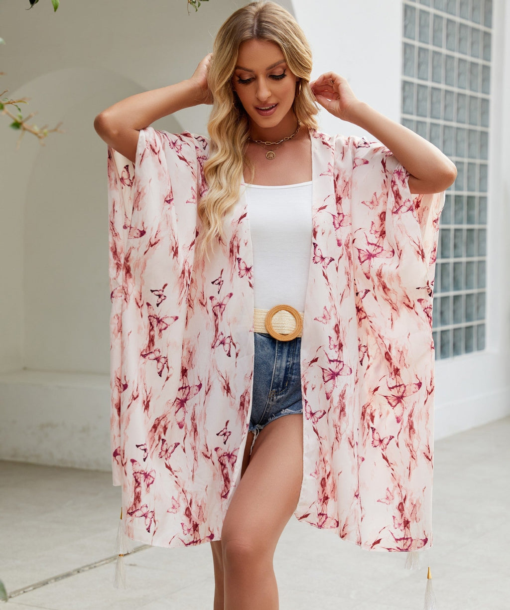 Women's elegant kimono with an artistic floral pattern and fringed edges, size GR