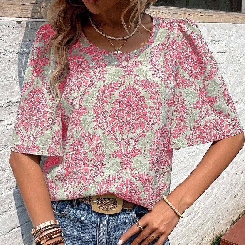 Women's blouse with voluminous sleeves and floral patterns, size