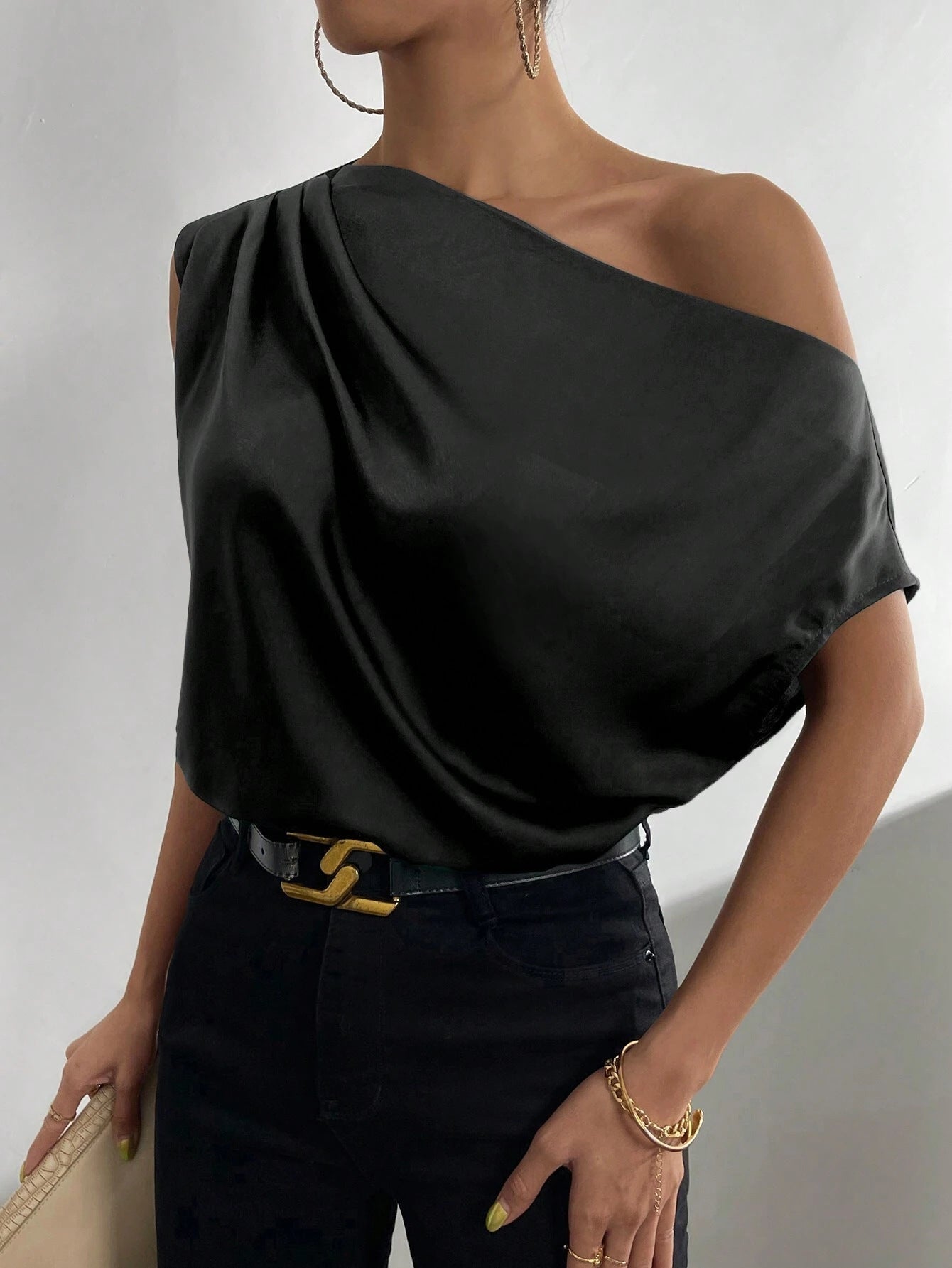 Women's asymmetrical top with draping and elegant cut, size