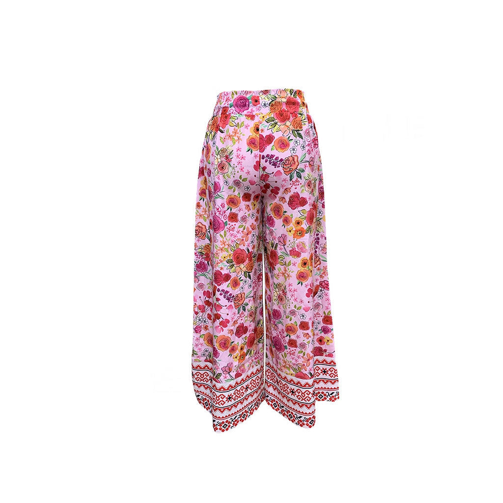 Women's wide-leg floral trousers with elasticated waistband and practical pockets, size