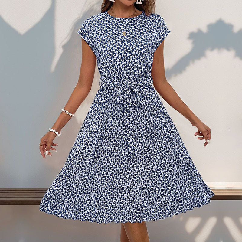 Women's midi dress with a sophisticated waist belt and playful pattern, size