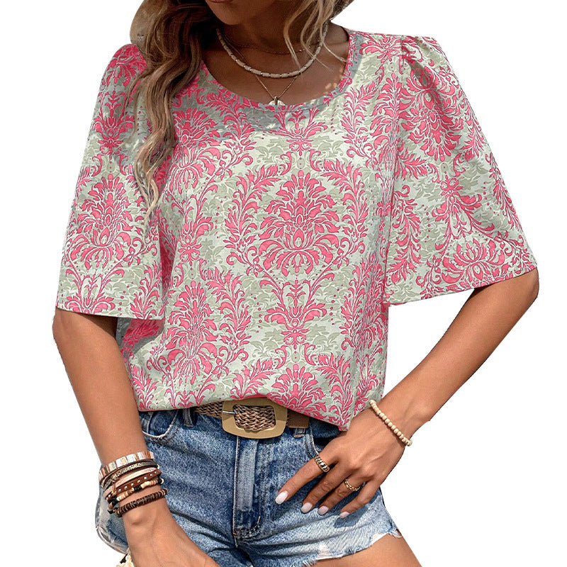 Women's blouse with voluminous sleeves and floral patterns, size
