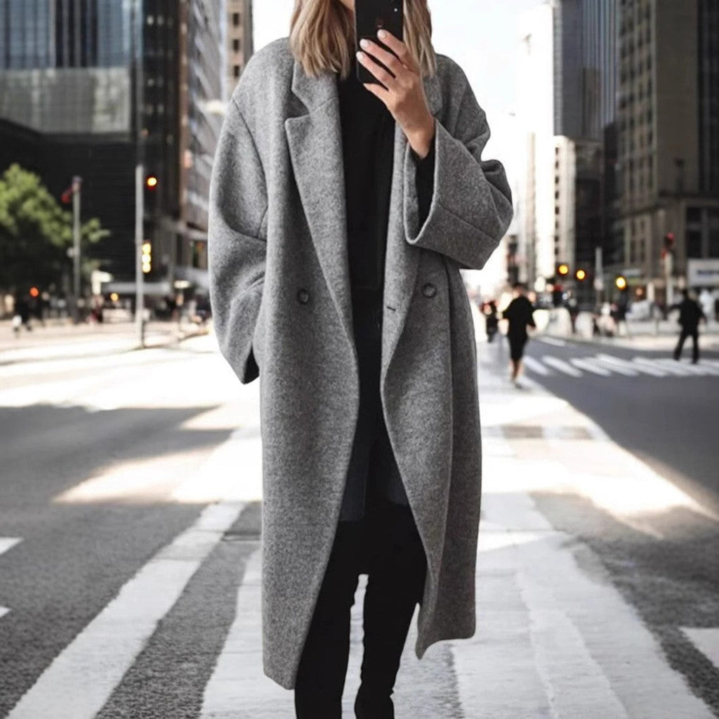 Women's oversized wool coat with an elegant cut and subtle snap buttons, size S