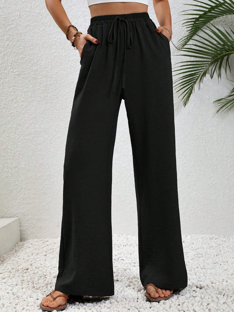Women's casual, wide-legged leisure trousers with elasticated waistband and side pockets, size S