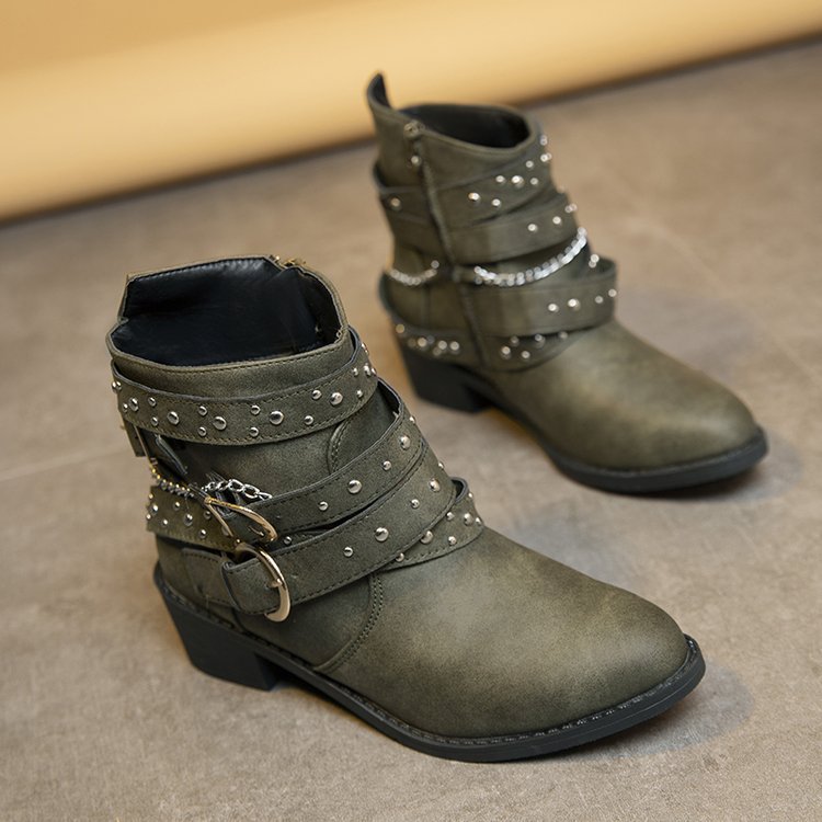 Women's ankle boots with a fashionable strap design and decorative accents, size S
