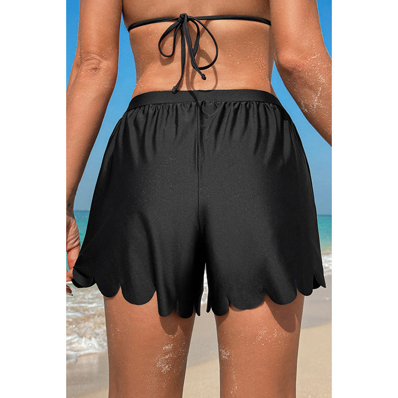 Women's swim shorts with decorative wavy trim and adjustable waistband, size