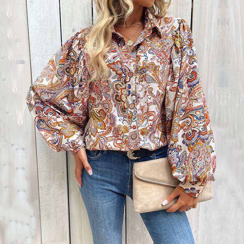 Women's blouse with a striking paisley pattern and voluminous puff sleeves, size [size missing]