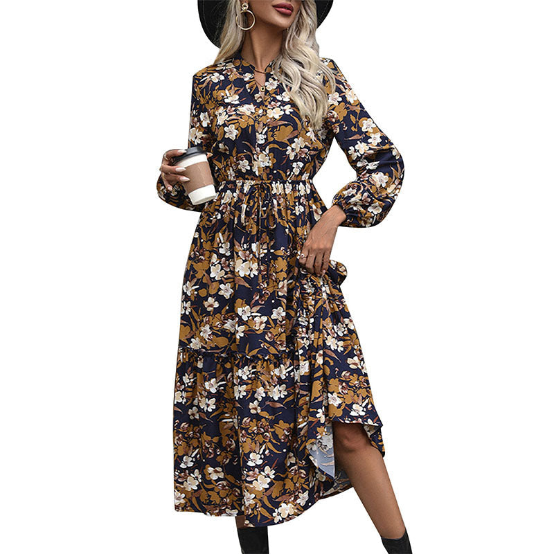 Women's midi dress with floral design and elegant waistline, size S
